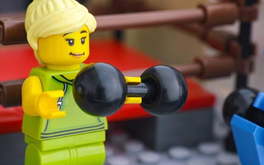 Lego woman minifigure lifting weights in a gym